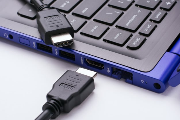 two-ends-hdmi-cable-near-hdmi-port-modern-blue-laptop